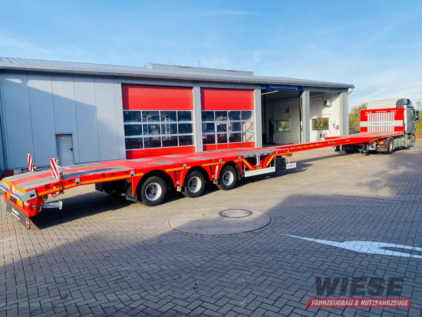 Kässbohrer Mega Tele HD Plattform Auflieger mit Radmulden